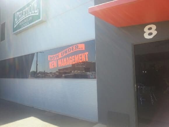 The original gym in 2013, with a sign in the window reading Now Under New Management